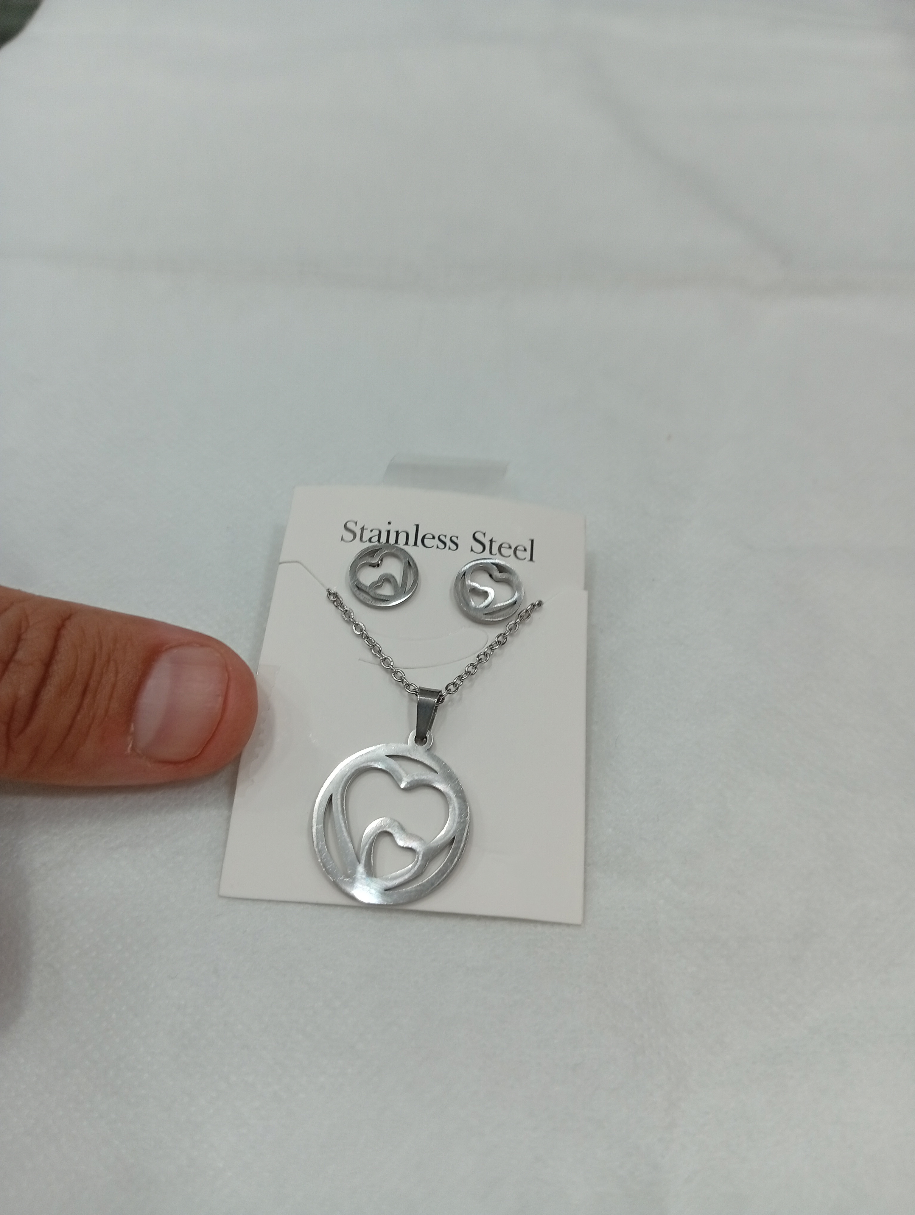 ست گردنبند و گوشواره طرح قلب حلقه ای - نقره ای