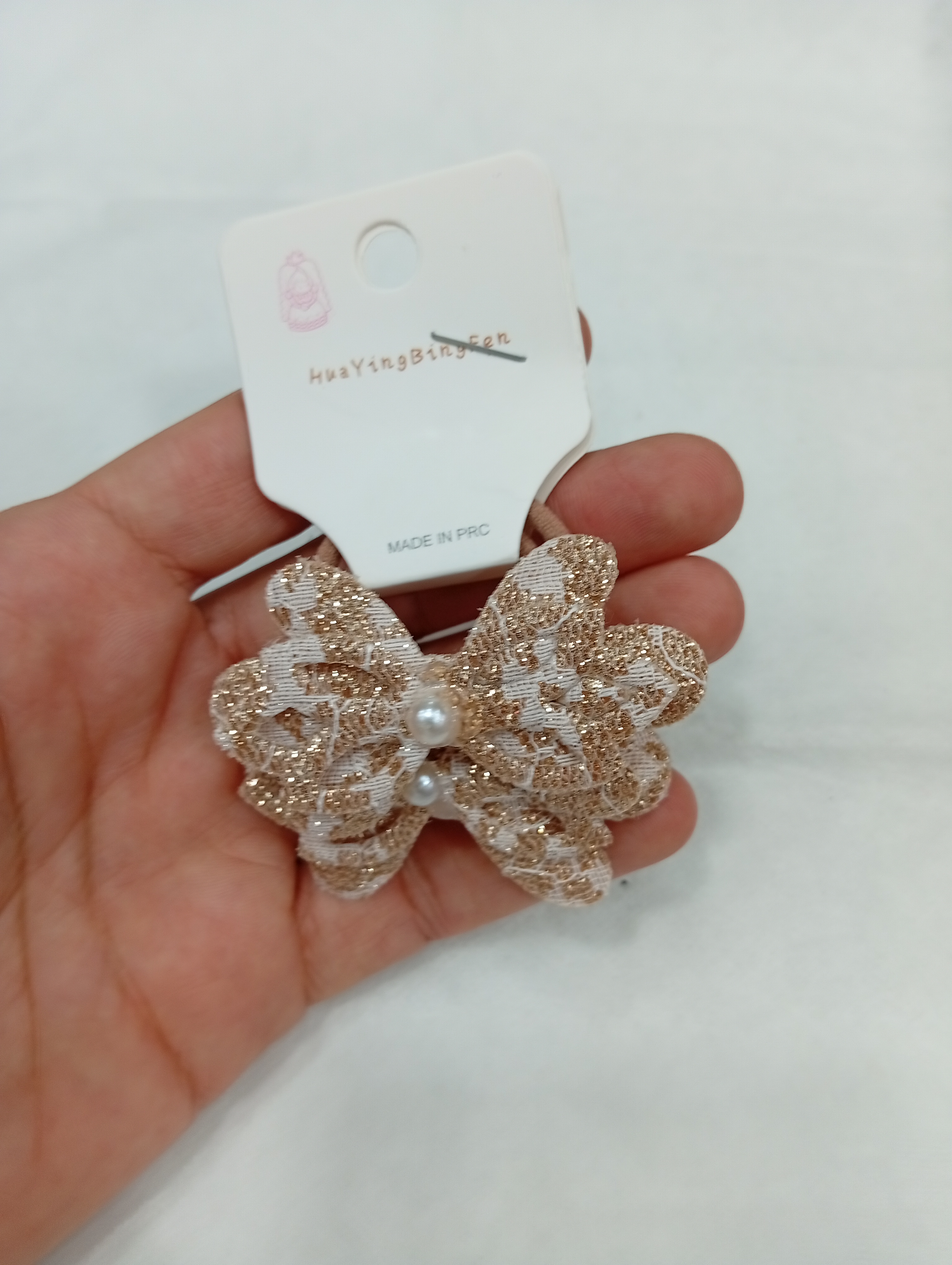 کش موی پارچه ای طرح گل پاپیونی لمه ای - 70 تومن - قهوه ای